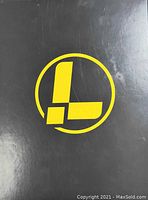 Black box with large yellow Leatherman logo on the top.