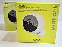 Front view of two Logitech Circle 2 camera boxes, showing product image and branding.