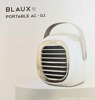 Photo of BLAUX Portable AC-G2 air cooler front view showing product branding and design details.