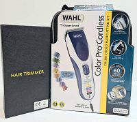 WAHL Color Pro Cordless Haircutting Kit in its original packaging next to a black carrying case marked 'Hair Trimmer'.