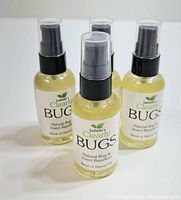 Four bottles of Isabella's Clearly Bugs natural bug and insect repellent spray shown from front with labels visible.