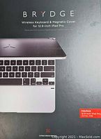 Photo of the front of the packaging showing the Brydge wireless keyboard and magnetic cover for 12.9-inch iPad Pro with partial keyboard visible.