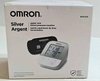 Front of box showing Omron Silver Argent BP5250 model and image of monitor with digital display reading blood pressure values.
