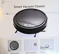 Photo of the product box showing the vacuum cleaner image and highlighting features like touch button, smart route plan and backwards anti-drop sensor.
