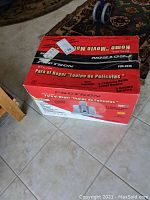 Original box of the Protron Home Movie Machine 5.1 Speaker System showing branding and system image on tiled floor.