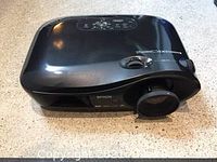 Top angle showing entire Epson PowerLite Pro Cinema 800 projector on a counter top.