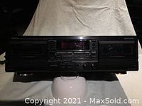 Front view of the Denon DRW 585 cassette to cassette recorder showing the cassette compartments, digital display, and control buttons.