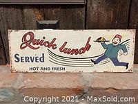 Photo of the rectangular metal sign with 'Quick lunch Served Hot and Fresh' text and running man illustration.