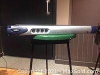 Full side view of the Digidesign Pro Tools MIDI I/O device showing the silver and blue metal casing, ventilation holes, MIDI label, and rackmount size