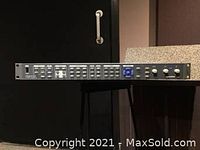 Front view of the rack-mounted Harris VTM 4100 Videotek Waveform Monitor showing buttons and knobs on the left side.