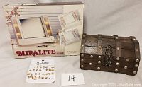 Photo showing the wooden jewelry box with metal studs, Miralite vanity mirror in box, and an Aldo card with multiple pairs of stud earrings.