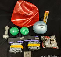 Full lot displayed on black fabric showing all included exercise equipment items.