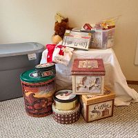 Photo of Christmas tins, hand towels, stacking boxes, and stuffed moose