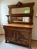 Full front view of oak sideboard with attached mirror