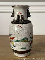 Full front view of the vase showing crackle glaze and warrior scene around the midsection.