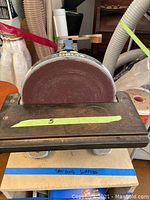 Front view of Delta disc sander with work table and disc installed