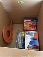 Box containing Blade-Loc blade storage, Craftsman template kit and Ridgid vacuum filter