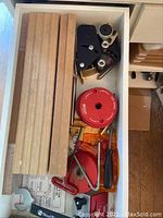 Drawer view with MDF fence rails, Jessem hold-downs and Woodpeckers rings
