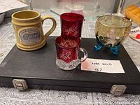 Lot arranged on black case with all items visible.