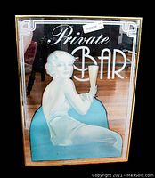 Front view of vintage mirror showing a stylized woman holding a glass and the text 'Private Bar'.