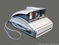 Front and side view of Polaroid One instant camera showing lens, flash, and wrist strap attached