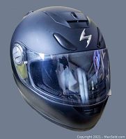Matte black Scorpion EXO-500 motorcycle helmet size Medium shown from front angle against gray background.