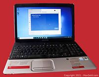 Front view of the HP Compaq Presario CQ60-420US laptop powered on showing Windows 10 recovery screen on a black keyboard and widescreen display.