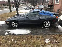 Driver side view under tarp on driveway
