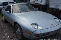 Front three-quarter view of silver Porsche 928