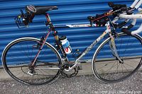 Left side view of complete bicycle showing frame, wheels and attached accessories