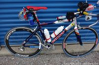 Left side view of entire bike showing frame, wheels, saddle and aerobars