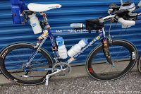 Bike left side showing frame, wheels, water bottles and decals