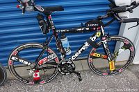 Full left-side view of the Cervélo bicycle showing frame, wheels, handlebars and accessories