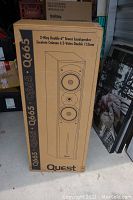 Box of Quest Q665 tower speaker showing front with speaker driver layout and branding