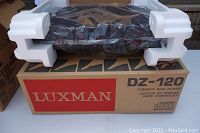 Luxman DZ-120 CD player in styrofoam and plastic on top of original box