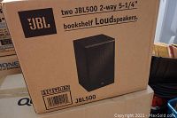 Box front showing JBL logo, model 500, and image of bookshelf speaker, indicating two speakers included.