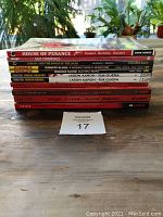 Stack of graphic novels shows titles and publishers including Dark Horse, Image, Dynamite, and Vertigo