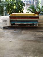 Side view of the stacked graphic novels showing title and volume numbers