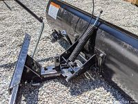 Close-up of snowblade mounting bracket, spring lift and attachment hardware