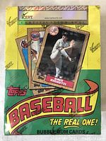 Front view of the unopened 1987 Topps Baseball bubble gum cards box showing player card images including Dave Righetti, and ICERT certification seal.