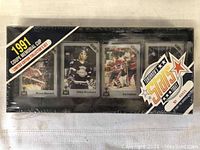 Front view of the sealed hockey card set packaging showing player cards and limited edition labels.