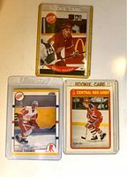 Front view of three Sergei Fedorov rookie hockey cards in protective sleeves showing different designs and team uniforms.