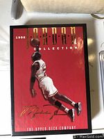 Photo of the closed Upper Deck 1996 Michael Jordan Collection box with red background and Jordan mid-air image.