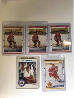 Front side of six Eric Lindros hockey cards in protective plastic cases.