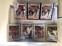 Front of several Jeremy Roenick hockey cards showing him in Phoenix Coyotes uniform in different poses and designs. Some cards are in plastic sleeves or holders.