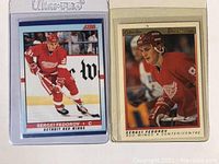 Front of two Sergei Fedorov hockey cards in red Detroit Red Wings uniform, displayed side by side in plastic sleeves.