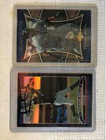 Front side of two Vernon Wells 2005 baseball cards in protective plastic cases, showing player image and design details.