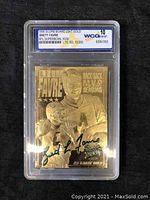 Front view of the 1996 Brett Favre 23 Karat Gold Football Card with a black autograph, graded Gem-Mint 10 by World Class Grading in a clear plastic case.