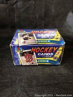 Box front and top showing 1990 Bowman Premier Edition hockey cards complete set of 264 cards, featuring images of hockey players and logos