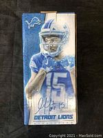 Front of box showing detailed image of Golden Tate bobble head in Lions uniform and signature graphic with number 15.